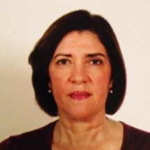 Image of Suhad Keblawi, presenting as a female with light brown skin and  shoulder length dark brown hair. 